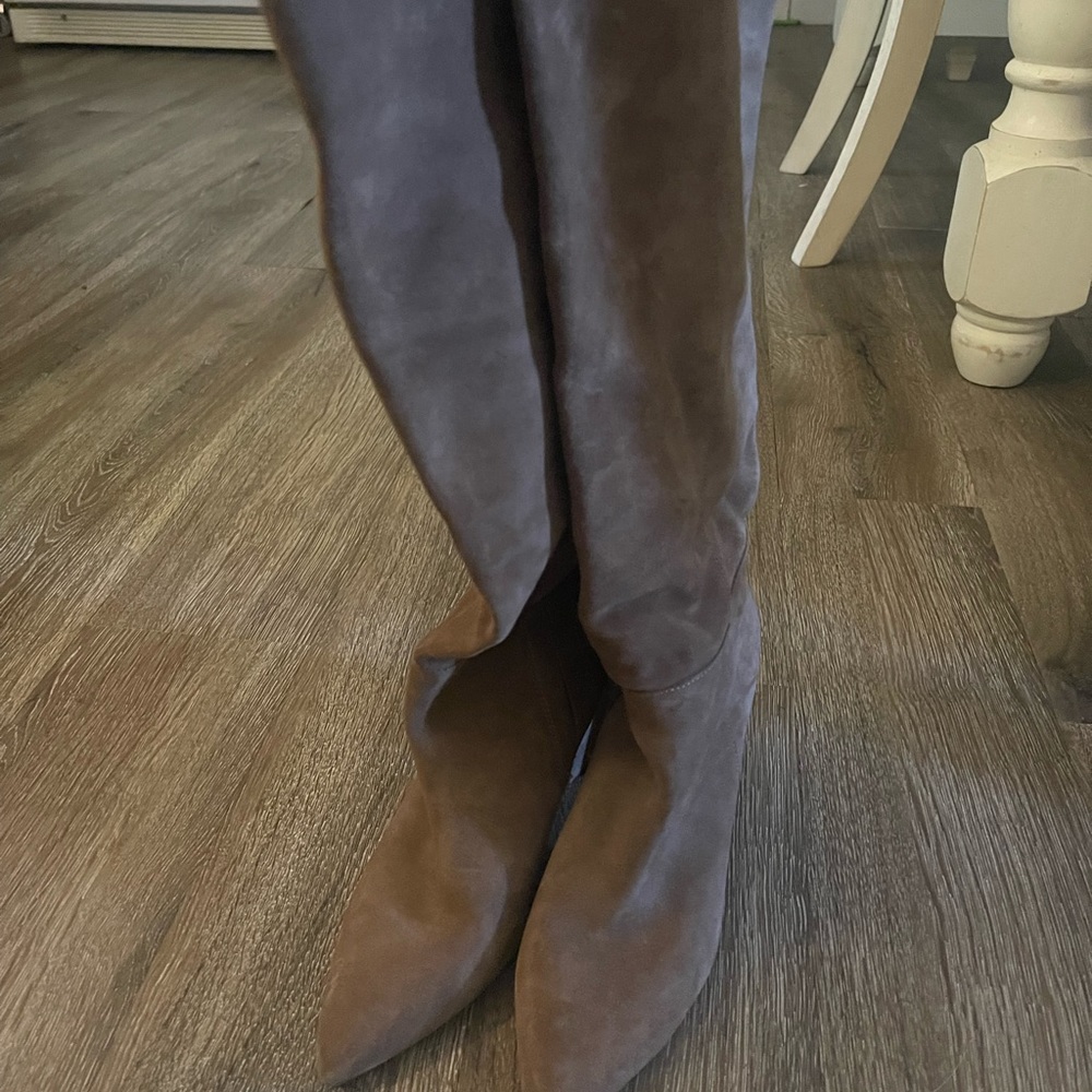 Knee high zip up heel boots